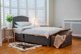 Grey Back Care Beds adjustable bed in a white room with wooden floor