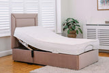 Pink Back Care Beds adjustable bed in a room with a plant and radiator.